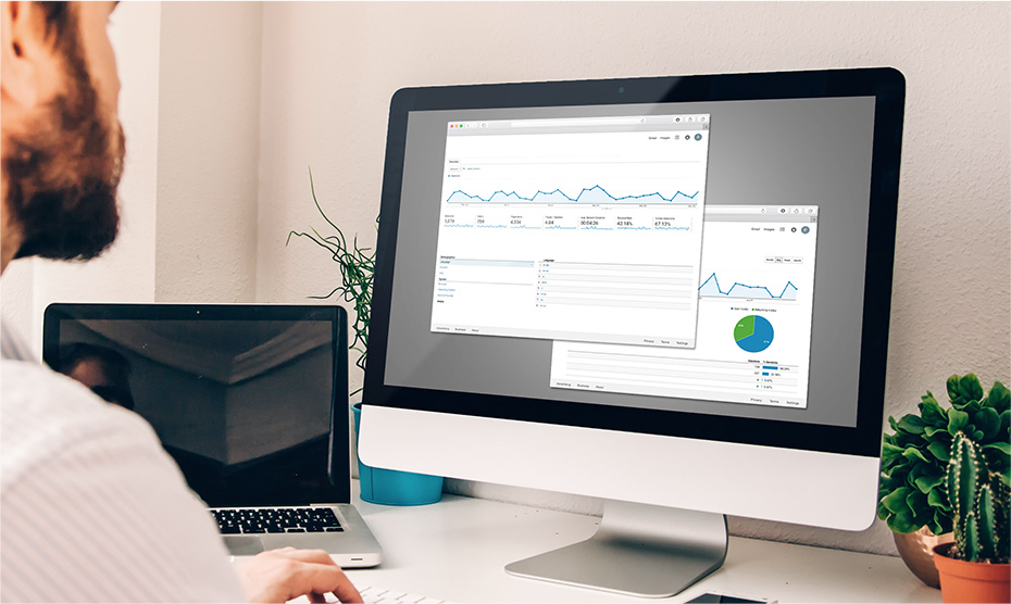 A man examining Google Analytics charts.